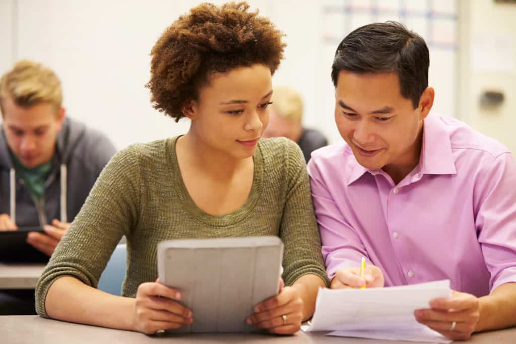 Teacher shows student a paper