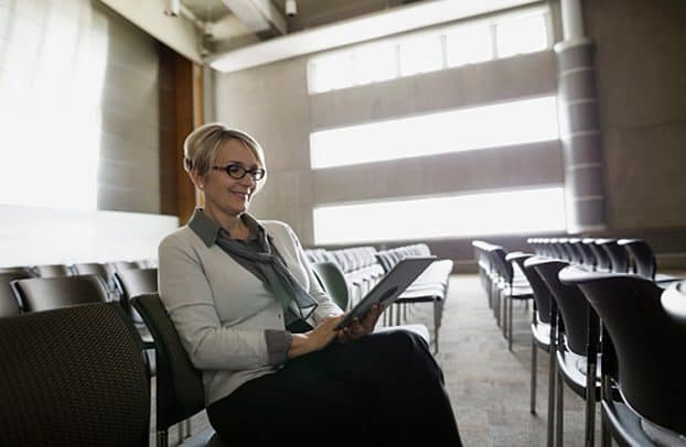 Woman smiling at laptop