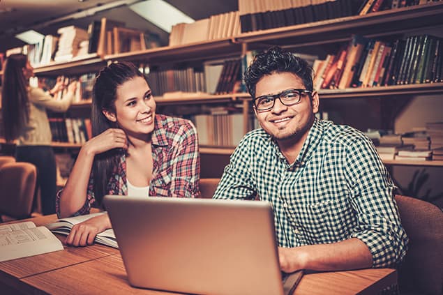 Two Indian students studying at the library