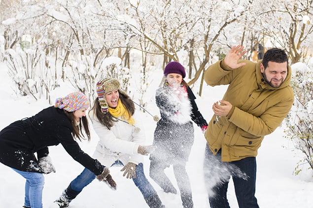 Students having a snowball fight over winter break