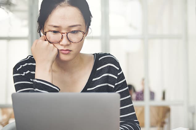 International student at her computer