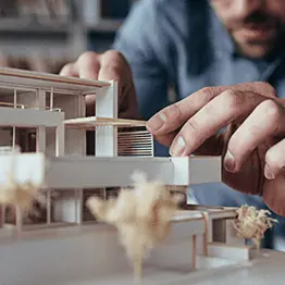 Man assembling a model building