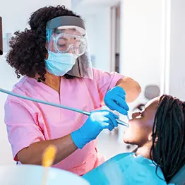 Dentist working on patient