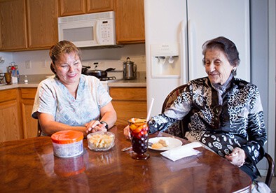 People sitting at kitchen table