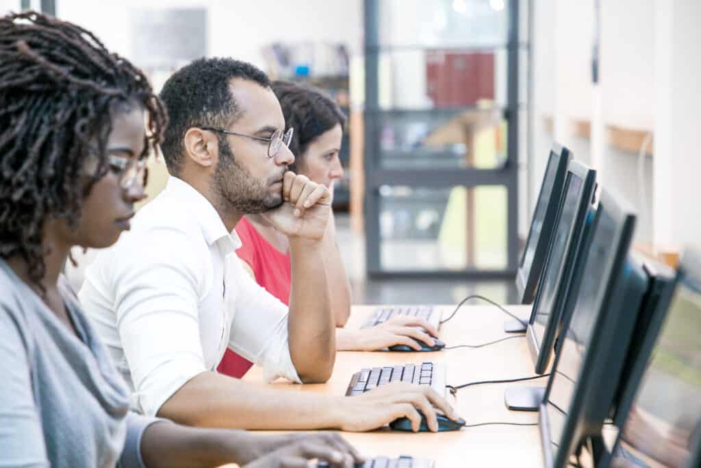 People in a computer lab - receiving support