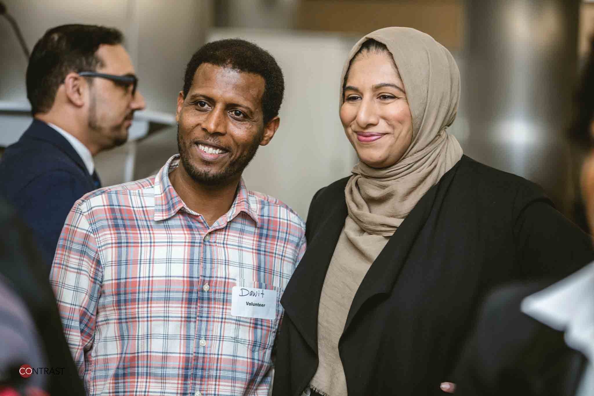 People smiling at conference