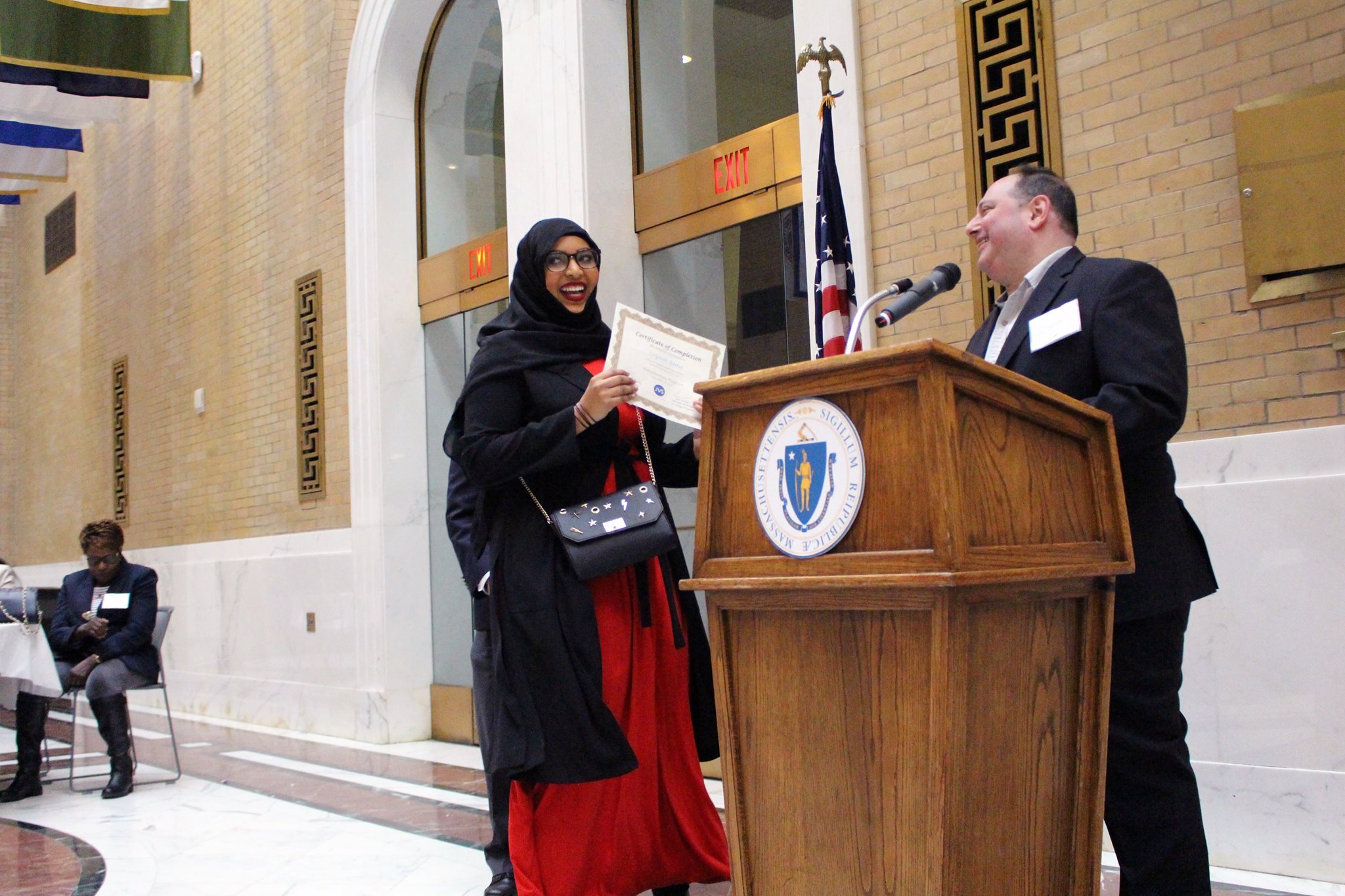 Woman receiving diploma